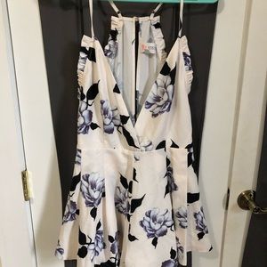 White and floral romper. Size medium.